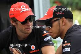 09.04.2011 Sepang, Malaysia,  Jenson Button (GBR), McLaren Mercedes and Lewis Hamilton (GBR), McLaren Mercedes  - Formula 1 World Championship, Rd 02, Malaysian Grand Prix, Saturday