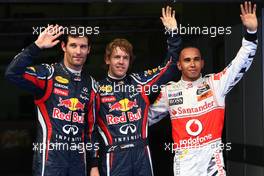 09.04.2011 Sepang, Malaysia,  Mark Webber (AUS), Red Bull Racing with pole position man Sebastian Vettel (GER), Red Bull Racing and Lewis Hamilton (GBR), McLaren Mercedes - Formula 1 World Championship, Rd 02, Malaysian Grand Prix, Saturday Qualifying