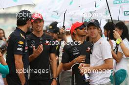 10.04.2011 Sepang, Malaysia,  Mark Webber (AUS), Red Bull Racing with Jenson Button (GBR), McLaren Mercedes and Sebastian Vettel (GER), Red Bull Racing - Formula 1 World Championship, Rd 02, Malaysian Grand Prix, Sunday