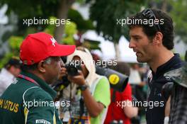 10.04.2011 Sepang, Malaysia,  Tony Fernandes, Team Lotus, Team Principal and Mark Webber (AUS), Red Bull Racing - Formula 1 World Championship, Rd 02, Malaysian Grand Prix, Sunday