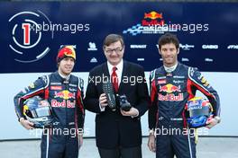 01.02.2011 Valencia, Spain,  Sebastian Vettel (GER) Red Bull Racing with Mark Webber (AUS), Red Bull Racing and a representative of GEOX - Red Bull Racing RB7 Launch - Formula 1 World Championship