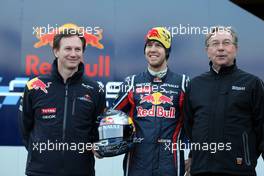 01.02.2011 Valencia, Spain,  Christian Horner (GBR), Red Bull Racing, Sporting Director and Sebastian Vettel (GER), Red Bull Racing and  Jean-Francois Caubet (FRA) Renault Head of Communications  - Red Bull Racing RB7 Launch - Formula 1 World Championship