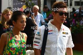 23.09.2011 Singapore, Singapore,  Kamui Kobayashi (JAP), Sauber F1 Team and his girlfriend - Formula 1 World Championship, Rd 14, Singapore Grand Prix, Friday