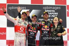 25.09.2011 Singapore, Singapore, 2nd place Jenson Button (GBR), McLaren Mercedes with 1st place Sebastian Vettel (GER), Red Bull Racing and 3rd place Mark Webber (AUS), Red Bull Racing  - Formula 1 World Championship, Rd 14, Singapore Grand Prix, Sunday Podium