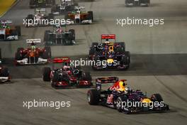 25.09.2011 Singapore, Singapore, Sebastian Vettel (GER), Red Bull Racing leads the start of the race  - Formula 1 World Championship, Rd 14, Singapore Grand Prix, Sunday Race