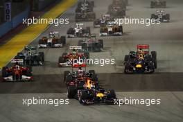 25.09.2011 Singapore, Singapore, Sebastian Vettel (GER), Red Bull Racing leads the start of the race  - Formula 1 World Championship, Rd 14, Singapore Grand Prix, Sunday Race