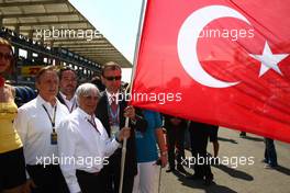 08.05.2011 Istanbul, Turkey,  Bernie Ecclestone (GBR) with the Turkish flag - Formula 1 World Championship, Rd 04, Turkish Grand Prix, Sunday Pre-Race Grid