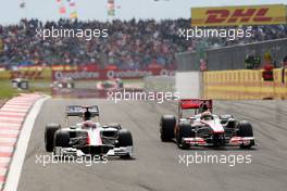 08.05.2011 Istanbul, Turkey,  Narain Karthikeyan (IND), Hispania Racing F1 Team, HRT, Lewis Hamilton (GBR), McLaren Mercedes - Formula 1 World Championship, Rd 04, Turkish Grand Prix, Sunday Race