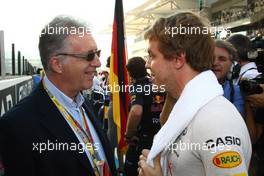 13.11.2011 Abu Dhabi, Abu Dhabi, Piero Ferrari with Sebastian Vettel (GER), Red Bull Racing  - Formula 1 World Championship, Rd 18, Abu Dhabi Grand Prix, Sunday Pre-Race Grid