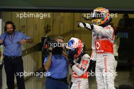 13.11.2011 Abu Dhabi, Abu Dhabi, Jenson Button (GBR), McLaren Mercedes and Lewis Hamilton (GBR), McLaren Mercedes  - Formula 1 World Championship, Rd 18, Abu Dhabi Grand Prix, Sunday Podium