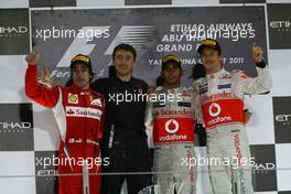 13.11.2011 Abu Dhabi, Abu Dhabi, Fernando Alonso (ESP), Scuderia Ferrari with 1st place Lewis Hamilton (GBR), McLaren Mercedes and Jenson Button (GBR), McLaren Mercedes  - Formula 1 World Championship, Rd 18, Abu Dhabi Grand Prix, Sunday Podium