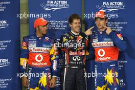 12.11.2011 Abu Dhabi, Abu Dhabi,  Lewis Hamilton (GBR), McLaren Mercedes, Sebastian Vettel (GER), Red Bull Racing and Jenson Button (GBR), McLaren Mercedes - Formula 1 World Championship, Rd 18, Abu Dhabi Grand Prix, Saturday Qualifying