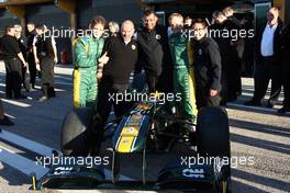 02.02.2011 Valencia, Spain,  Lotus team photo, Jarno Trulli (ITA), Team Lotus, Mike Gascoyne (GBR), Team Lotus, Chief Technical Officer, Tony Fernandes, Team Lotus, Team Principal, Heikki Kovalainen (FIN), Team Lotus - Formula 1 Testing - Formula 1 World Championship 2011