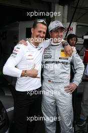 Michael Schumacher (GER) Mercedes Grand Prix with Ralf Schumacher (GER), Team HWA AMG Mercedes, AMG Mercedes C-Coupe 29.04.2012. DTM Round 1, Sunday, Hockenheim, Germany
