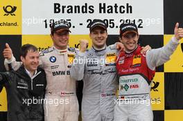 2nd place Bruno Spengler (CAN) BMW Team Schnitzer BMW M3 DTM with 1st place Gary Paffett (GBR), Team HWA AMG Mercedes, AMG Mercedes C-Coupe and 3rd place Mike Rockenfeller (GER) Audi Sport Team Phoenix Racing Audi A5 DTM  20.05.2012. DTM Round 3, Brands Hatch