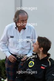 Sir Jackie Stewart with Romain Grosjean (FRA), Lotus Renault F1 Team  18.03.2012. Formula 1 World Championship, Rd 1, Australian Grand Prix, Melbourne, Australia, Sunday