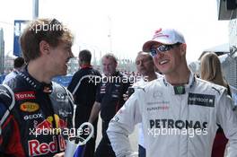 Sebastian Vettel (GER), Red Bull Racing and Michael Schumacher (GER), Mercedes AMG Petronas  18.03.2012. Formula 1 World Championship, Rd 1, Australian Grand Prix, Melbourne, Australia, Sunday