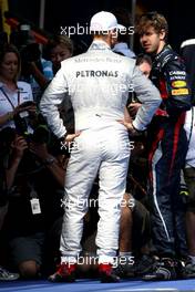 Michael Schumacher (GER), Mercedes GP and Sebastian Vettel (GER), Red Bull Racing  18.03.2012. Formula 1 World Championship, Rd 1, Australian Grand Prix, Melbourne, Australia, Sunday