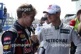 Sebastian Vettel (GER), Red Bull Racing and Michael Schumacher (GER), Mercedes AMG Petronas  18.03.2012. Formula 1 World Championship, Rd 1, Australian Grand Prix, Melbourne, Australia, Sunday