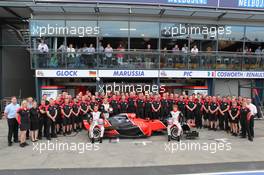 Marussia team photo with Timo Glock (GER), Marussia F1 Team and Charles Pic (FRA), Marussia F1 Team  18.03.2012. Formula 1 World Championship, Rd 1, Australian Grand Prix, Melbourne, Australia, Sunday