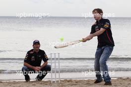 Sebastian Vettel (GER), Red Bull Racing and Mark Webber (AUS), Red Bull Racing playing cricket on the beach  14.03.2012. Formula 1 World Championship, Rd 1, Australian Grand Prix, Melbourne, Australia, Wednesday
