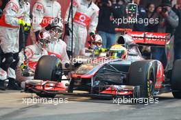 02.04.2012, Barcelona, Spain, Lewis Hamilton (GBR), McLaren Mercedes pit stop practice goes a bit wong when a wheel gun gets stuck and Lewis tries to drive on - Formula 1 Testing, day 2 - Formula 1 World Championship