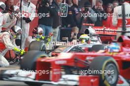 02.04.2012, Barcelona, Spain, Lewis Hamilton (GBR), McLaren Mercedes pit stop practice goes a bit wong when a wheel gun gets stuck and Lewis tries to drive on - Formula 1 Testing, day 2 - Formula 1 World Championship