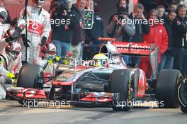 02.04.2012, Barcelona, Spain, Lewis Hamilton (GBR), McLaren Mercedes pit stop practice goes a bit wong when a wheel gun gets stuck and Lewis tries to drive on - Formula 1 Testing, day 2 - Formula 1 World Championship