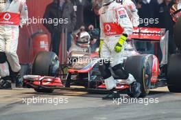 02.04.2012, Barcelona, Spain, Lewis Hamilton (GBR), McLaren Mercedes pit stop practice goes a bit wong when a wheel gun gets stuck and Lewis tries to drive on - Formula 1 Testing, day 2 - Formula 1 World Championship