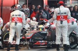 02.04.2012, Barcelona, Spain, Lewis Hamilton (GBR), McLaren Mercedes pit stop practice goes a bit wong when a wheel gun gets stuck and Lewis tries to drive on - Formula 1 Testing, day 2 - Formula 1 World Championship