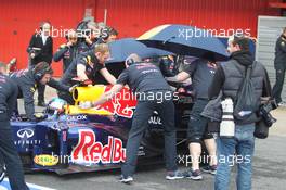 04.03.2012, Barcelona, Spain, Sebastian Vettel (GER), Red Bull Racing and the Red Bull mechanics try to hide his car - Formula 1 Testing, day 4 - Formula 1 World Championship