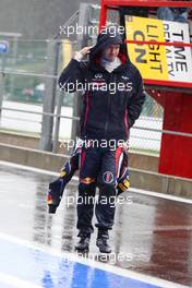 Sebastian Vettel (GER), Red Bull Racing walking in the wet pitlane 31.08.2012. Formula 1 World Championship, Rd 12, Belgian Grand Prix, Spa Francorchamps, Belgium, Practice Day