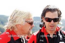 (L to R): Sir Richard Branson (GBR) Virgin Group Owner with Marc Hynes (GBR) Marussia F1 Team Driver Coach. 02.09.2012. Formula 1 World Championship, Rd 12, Belgian Grand Prix, Spa Francorchamps, Belgium, Race Day