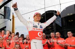 Race winner Jenson Button (GBR) McLaren celebrates with the team. 02.09.2012. Formula 1 World Championship, Rd 12, Belgian Grand Prix, Spa Francorchamps, Belgium, Race Day