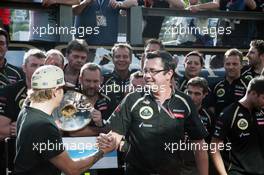 Kimi Raikkonen (FIN) Lotus F1 Team celebrates his third position with Eric Boullier (FRA) Lotus F1 Team Principal and the team. 02.09.2012. Formula 1 World Championship, Rd 12, Belgian Grand Prix, Spa Francorchamps, Belgium, Race Day