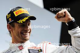 Race winner Jenson Button (GBR) McLaren celebrates on the podium. 02.09.2012. Formula 1 World Championship, Rd 12, Belgian Grand Prix, Spa Francorchamps, Belgium, Race Day