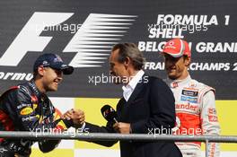 Sebastian Vettel (GER) Red Bull Racing on the podium with Jacky Ickx (BEL). 02.09.2012. Formula 1 World Championship, Rd 12, Belgian Grand Prix, Spa Francorchamps, Belgium, Race Day