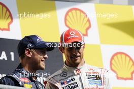 Race winner Jenson Button (GBR) McLaren on the podium with Jenson Button (GBR) McLaren. 02.09.2012. Formula 1 World Championship, Rd 12, Belgian Grand Prix, Spa Francorchamps, Belgium, Race Day