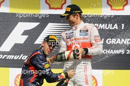 Race winner Jenson Button (GBR) McLaren celebrates on the podium with Sebastian Vettel (GER) Red Bull Racing. 02.09.2012. Formula 1 World Championship, Rd 12, Belgian Grand Prix, Spa Francorchamps, Belgium, Race Day