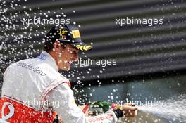 Race winner Jenson Button (GBR) McLaren celebrates on the podium. 02.09.2012. Formula 1 World Championship, Rd 12, Belgian Grand Prix, Spa Francorchamps, Belgium, Race Day