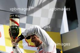 Race winner Jenson Button (GBR) McLaren celebrates on the podium. 02.09.2012. Formula 1 World Championship, Rd 12, Belgian Grand Prix, Spa Francorchamps, Belgium, Race Day