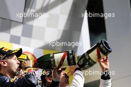 Race winner Jenson Button (GBR) McLaren celebrates on the podium with Sebastian Vettel (GER) Red Bull Racing. 02.09.2012. Formula 1 World Championship, Rd 12, Belgian Grand Prix, Spa Francorchamps, Belgium, Race Day