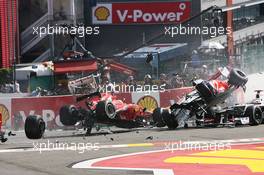 A crash at the start of the race involving Lewis Hamilton (GBR) McLaren MP4/27 and Romain Grosjean (FRA) Lotus F1 E20; Fernando Alonso (ESP) Ferrari F2012; Sergio Perez (MEX) Sauber C31 and Pastor Maldonado (VEN) Williams FW34. 02.09.2012. Formula 1 World Championship, Rd 12, Belgian Grand Prix, Spa Francorchamps, Belgium, Race Day