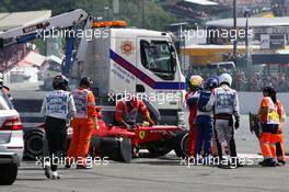 Fernando Alonso (ESP) Ferrari F2012 is helped from his car after a crash at the start of the race. 02.09.2012. Formula 1 World Championship, Rd 12, Belgian Grand Prix, Spa Francorchamps, Belgium, Race Day