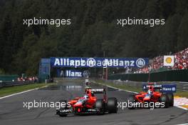 Charles Pic (FRA) Marussia F1 Team MR01 and team mate Timo Glock (GER) Marussia F1 Team MR01. 02.09.2012. Formula 1 World Championship, Rd 12, Belgian Grand Prix, Spa Francorchamps, Belgium, Race Day