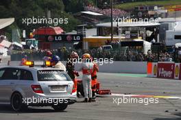 (L to R): Romain Grosjean (FRA) Lotus F1 Team and Lewis Hamilton (GBR) McLaren talk after they were involved in a crash at the start of the race. 02.09.2012. Formula 1 World Championship, Rd 12, Belgian Grand Prix, Spa Francorchamps, Belgium, Race Day