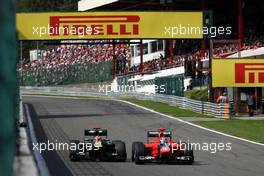 Heikki Kovalainen (FIN), Caterham F1 Team overtakes Timo Glock (GER), Marussia F1 Team  02.09.2012. Formula 1 World Championship, Rd 12, Belgian Grand Prix, Spa Francorchamps, Belgium, Race Day