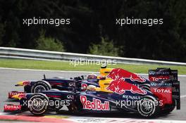 Mark Webber (AUS) Red Bull Racing RB8 and team mate Sebastian Vettel (GER) Red Bull Racing RB8 battle for position. 02.09.2012. Formula 1 World Championship, Rd 12, Belgian Grand Prix, Spa Francorchamps, Belgium, Race Day