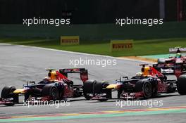 Mark Webber (AUS) Red Bull Racing RB8 and team mate Sebastian Vettel (GER) Red Bull Racing RB8 battle for position. 02.09.2012. Formula 1 World Championship, Rd 12, Belgian Grand Prix, Spa Francorchamps, Belgium, Race Day