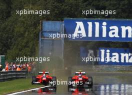 (L to R): Timo Glock (GER) Marussia F1 Team MR01 and team mate Charles Pic (FRA) Marussia F1 Team MR01 battle for position. 02.09.2012. Formula 1 World Championship, Rd 12, Belgian Grand Prix, Spa Francorchamps, Belgium, Race Day